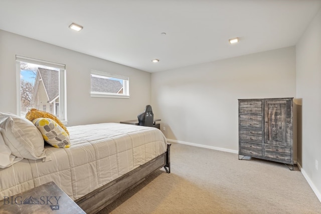 bedroom featuring carpet floors and multiple windows