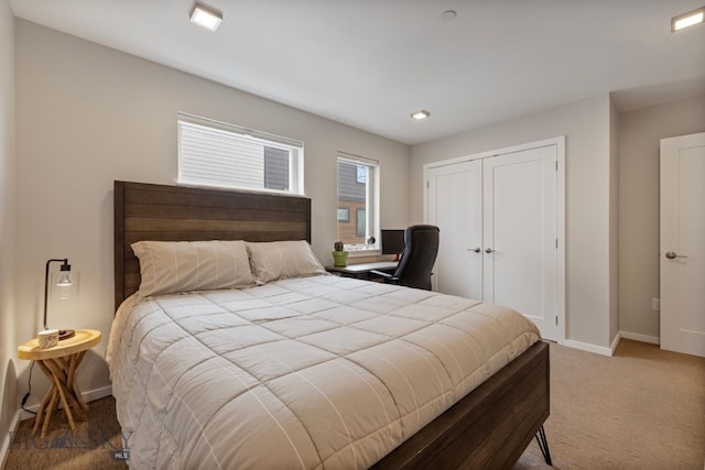 bedroom with carpet, a closet, and multiple windows