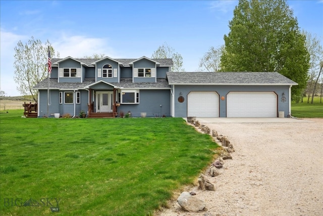 view of front of property with a garage and a front lawn