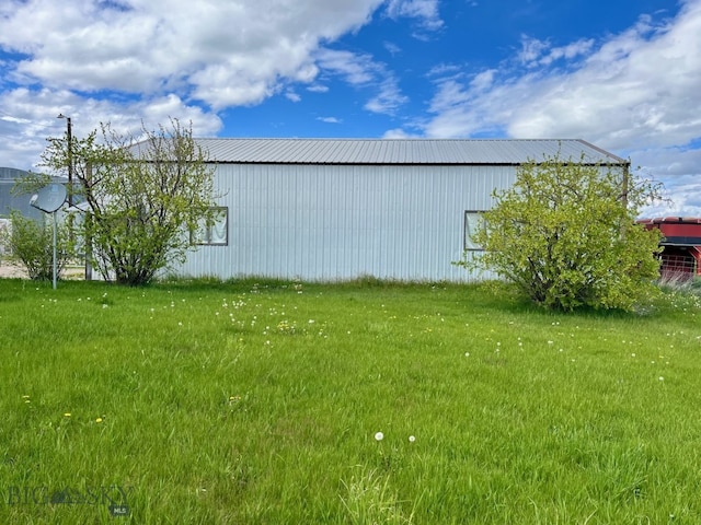 view of home's exterior with a lawn