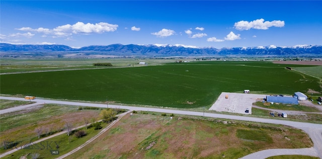 drone / aerial view featuring a mountain view and a rural view