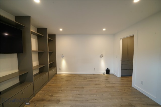 spare room with wood-type flooring