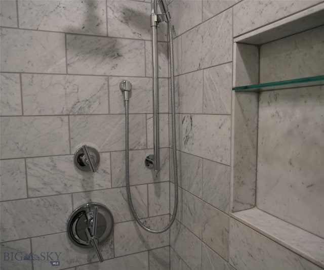 interior details with a tile shower