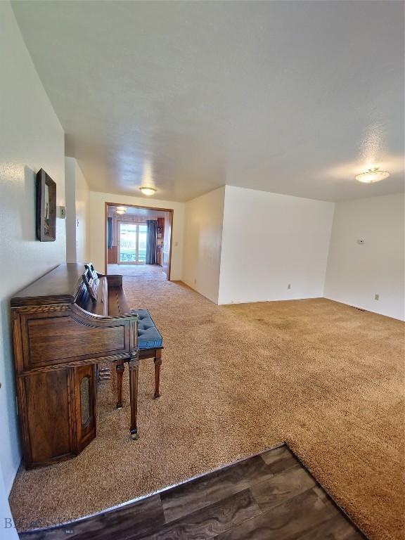 512 S Oak, Townsend, MT 59644 - living room with dark colored carpet