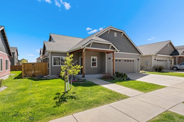 view of front of house featuring a front lawn and a garage