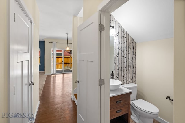 bathroom featuring hardwood / wood-style floors, vanity, and toilet