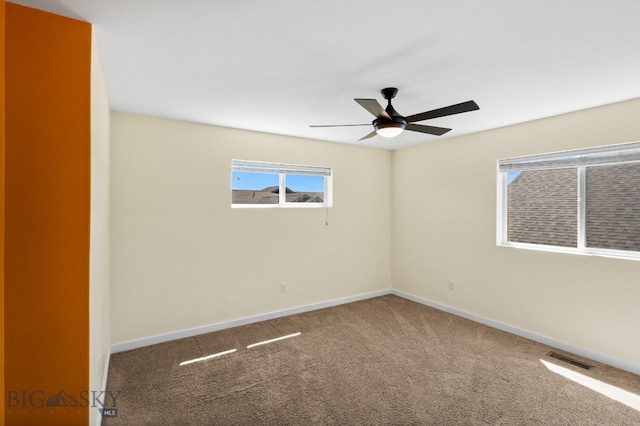 carpeted empty room with ceiling fan