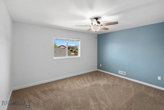 empty room with carpet and ceiling fan