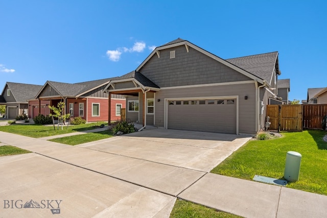 view of front of property featuring a front lawn and a garage