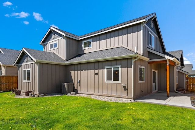 rear view of property with a patio area and a lawn