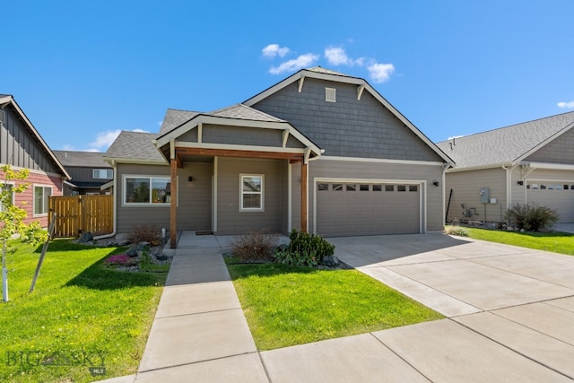 view of front of house featuring a garage and a front yard