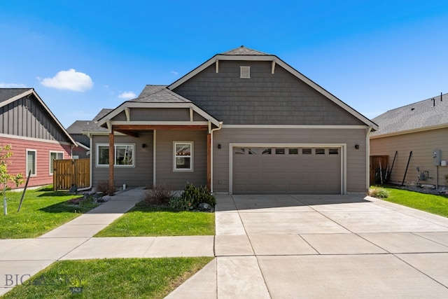 view of front of home with a garage and a front yard