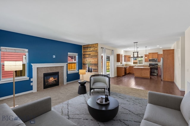 carpeted living room featuring a fireplace