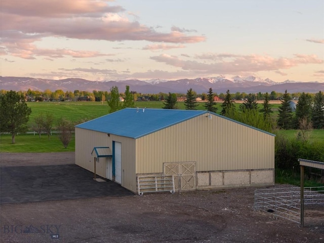 view of outdoor structure featuring a mountain view and an outdoor structure