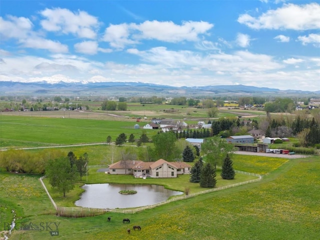 bird's eye view featuring a rural view and a water and mountain view