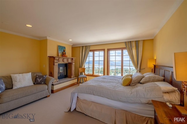 5275 Riverview Dr, Helena, MT 59602 - carpeted bedroom featuring crown molding, a glass covered fireplace, and recessed lighting