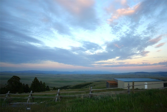 mountain view featuring a rural view