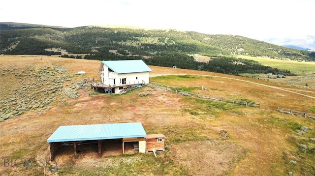 birds eye view of property with a mountain view and a rural view