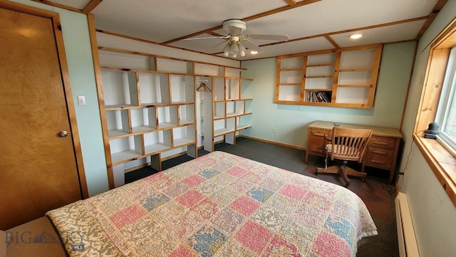 carpeted bedroom with ceiling fan and baseboard heating