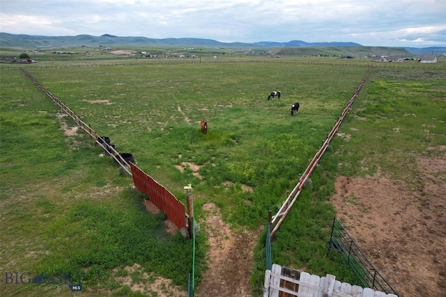 drone / aerial view featuring a mountain view and a rural view