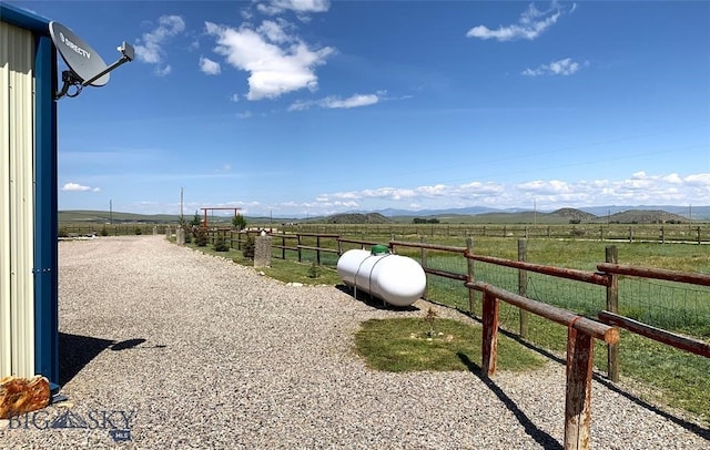 view of yard with a rural view