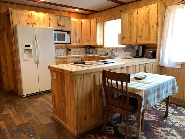 kitchen featuring white appliances, sink, crown molding, tile countertops, and dark hardwood / wood-style flooring