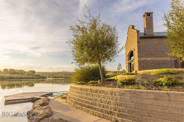 surrounding community featuring a water view