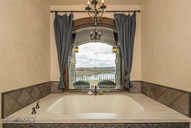 bathroom featuring an inviting chandelier