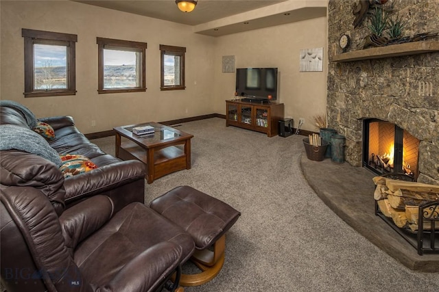 living room with carpet flooring and a fireplace