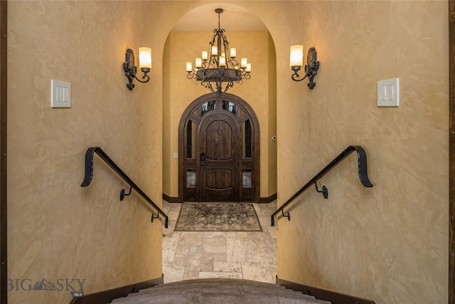 entrance foyer featuring a chandelier