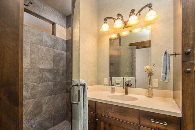 bathroom featuring vanity and an enclosed shower