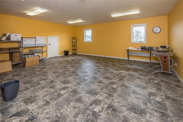 basement featuring a textured ceiling