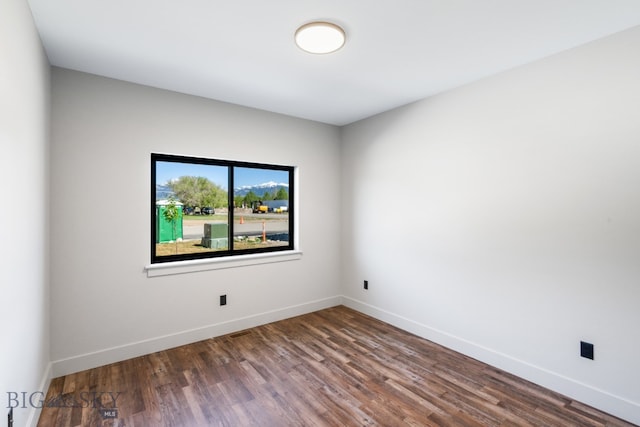 spare room featuring hardwood / wood-style floors