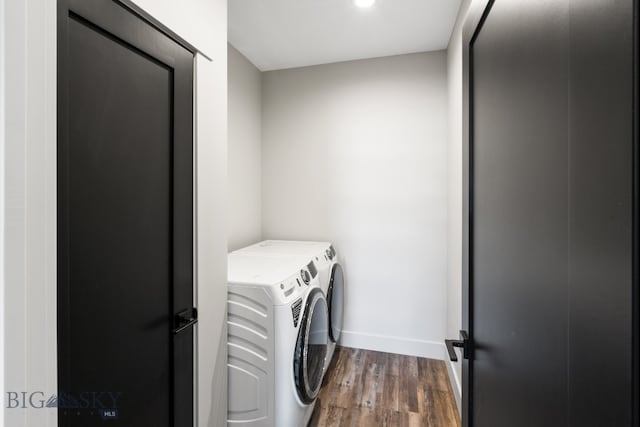 laundry room featuring separate washer and dryer and dark wood-type flooring