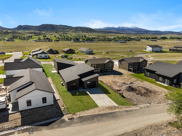 drone / aerial view featuring a mountain view