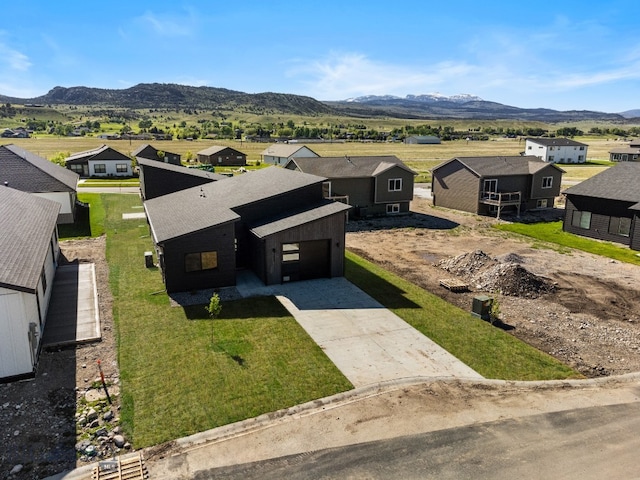 birds eye view of property featuring a mountain view