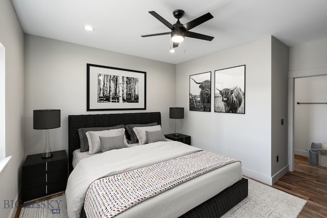 bedroom with ceiling fan and wood-type flooring