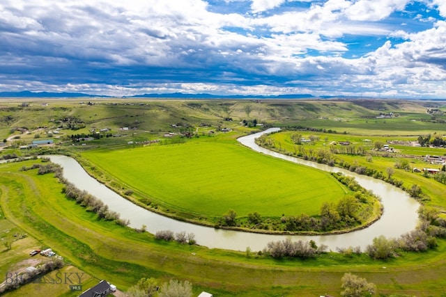 view of home's community featuring a rural view and a water view