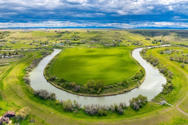 birds eye view of property with a water view and a rural view