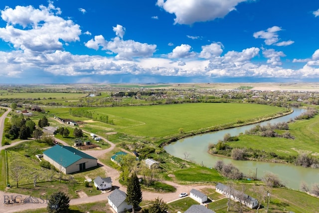 drone / aerial view with a rural view and a water view