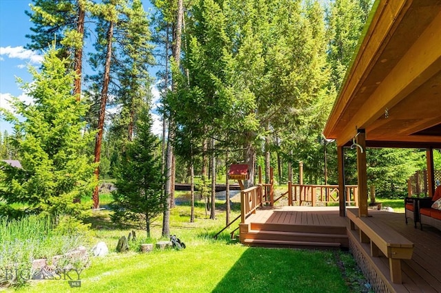 view of yard featuring a wooden deck