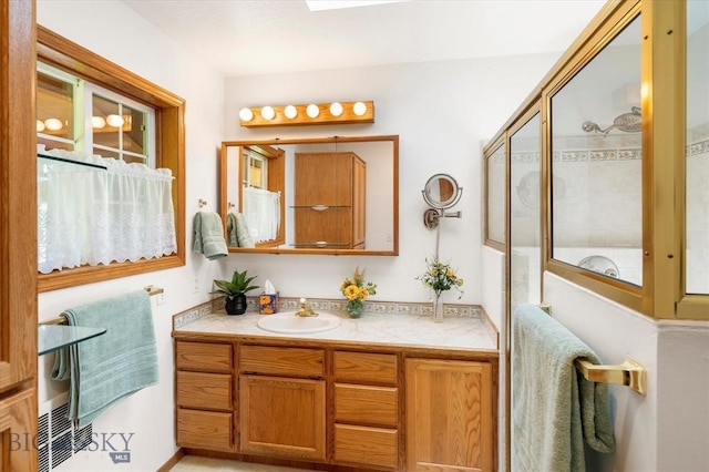 bathroom with vanity with extensive cabinet space