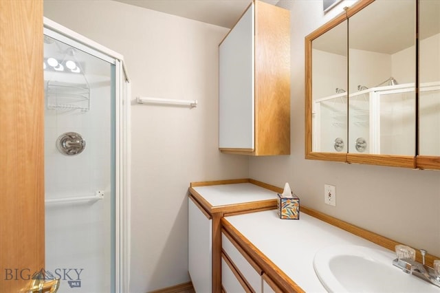 bathroom with walk in shower and large vanity