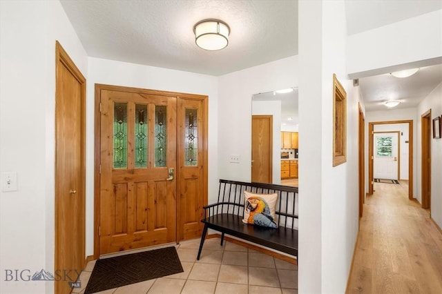 view of tiled foyer entrance