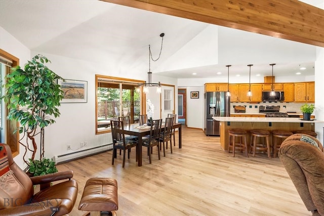 dining room with a baseboard heating unit, high vaulted ceiling, beam ceiling, and light wood-type flooring