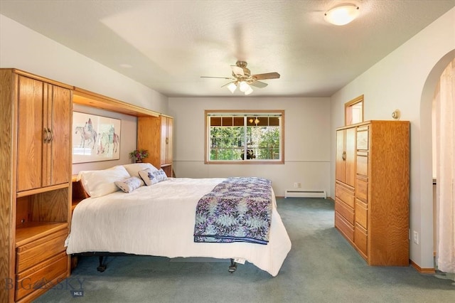 bedroom with carpet flooring, baseboard heating, and ceiling fan