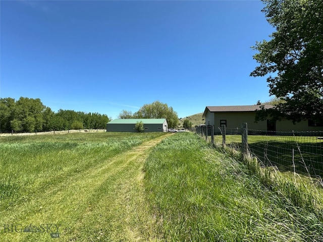 view of yard with a rural view