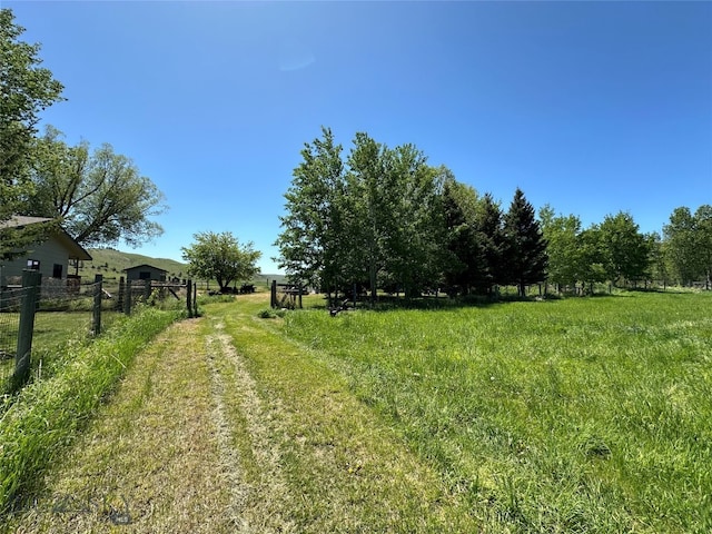 view of yard with a rural view