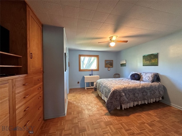 bedroom featuring light parquet floors and ceiling fan