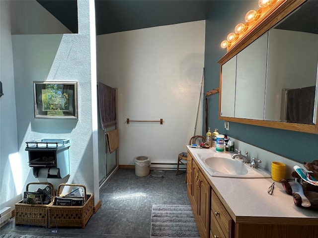 bathroom with a baseboard radiator and vanity